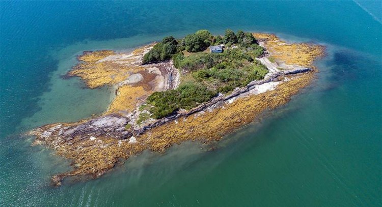Crab Island, up for sale for the first time in 65 years, appears to have a buyer. It has a two-bedroom cottage and was once owned by Robert Peary.