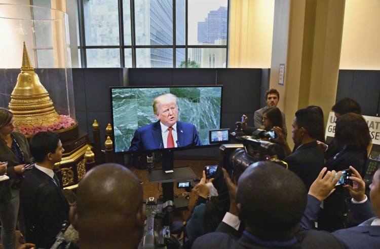 As President Trump addresses the 73rd session of the United Nations General Assembly, members of the media watch a video feed of the speech outside the General Assembly  Hall on Tuesday at UN headquarters. In his speech, Trump emphasized how his administration has rejected what he calls "the ideology of globalism."