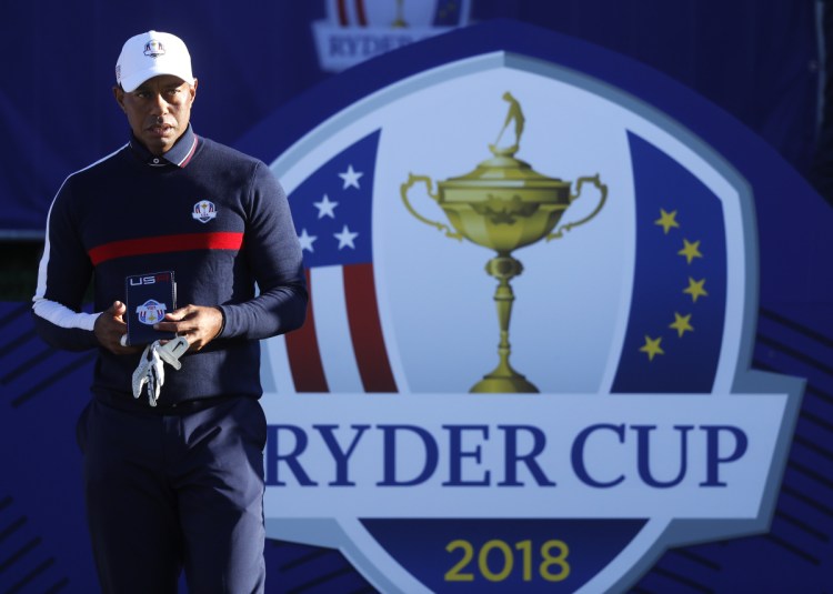 Tiger Woods of the US stands on the 1st tee before playing a shot in practice at Le Golf National in Guyancourt, outside Paris, France, Tuesday, Sept. 25, 2018. The 42nd Ryder Cup will be held in France from Sept. 28-30, 2018 at Le Golf National. (AP Photo/Alastair Grant)