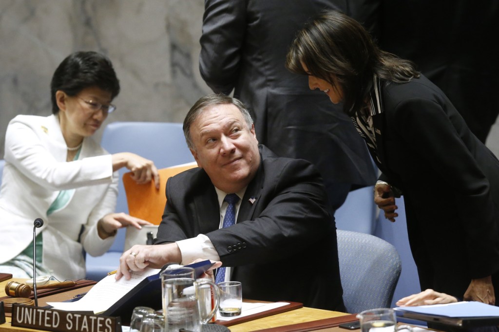 Secretary of State Mike Pompeo talks with Ambassador to the U.N. Nikki Haley at the U.N. on Thursday.