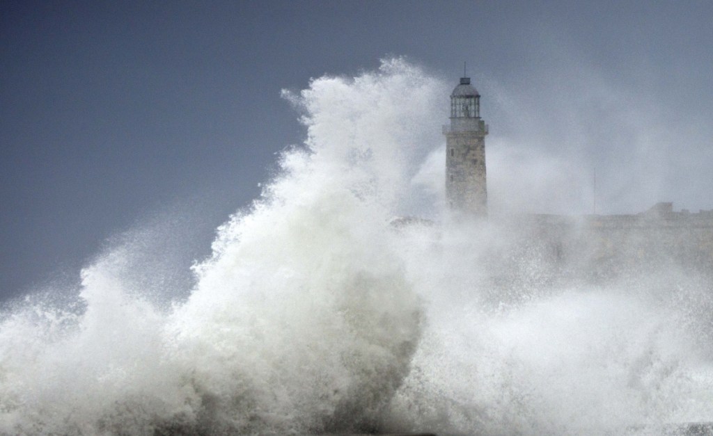 Waves dwarf a lighthouse in Havana, Cuba, as Hurricane Irma arrives in 2017.