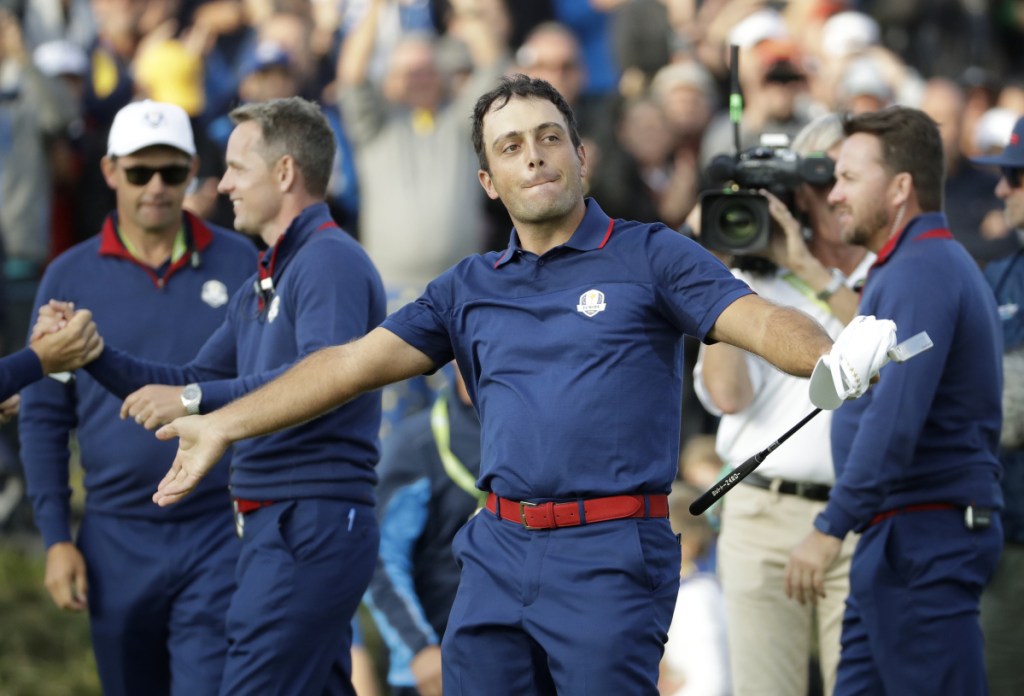 Europe's Francesco Molinari celebrates after winning a foursome match with his partner Tommy Fleetwood on the opening day of the Ryder Cup at Le Golf National in Saint-Quentin-en-Yvelines, France, on Friday. Molinari and Fleetwood beat Justin Thomas and Jordan Spieth of the U.S., 5 and 4. (AP Photo/Matt Dunham)