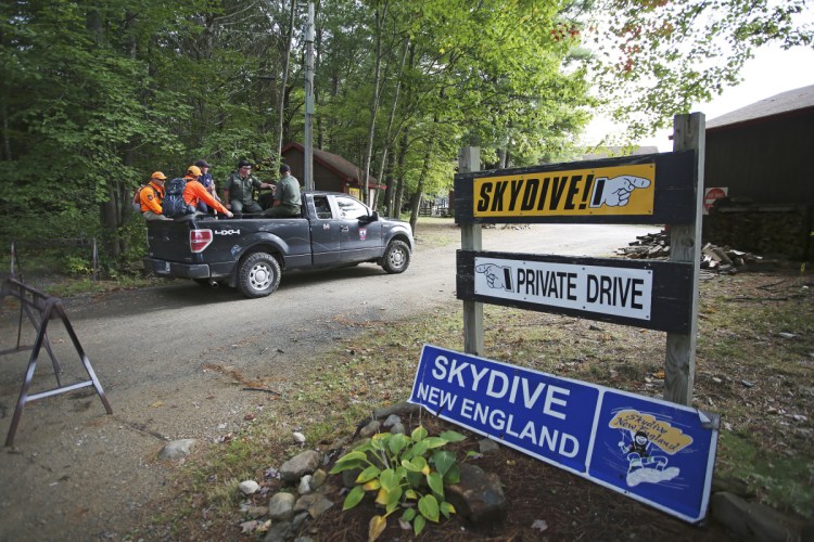 Members of the Maine Warden Service head out on Sept. 28 to search for the body of Brett Bickford, a skydive instructor who reportedly got detached from his student during a tandem jump a day earlier.