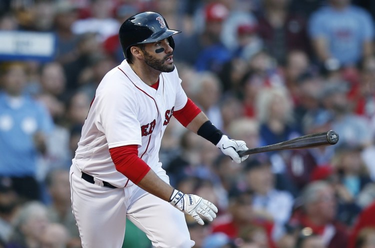 Boston's J.D. Martinez watches his three-run home run during the fourth inning of the Red Sox' 10-2 win over the Yankees on Sunday at Fenway Park in Boston.