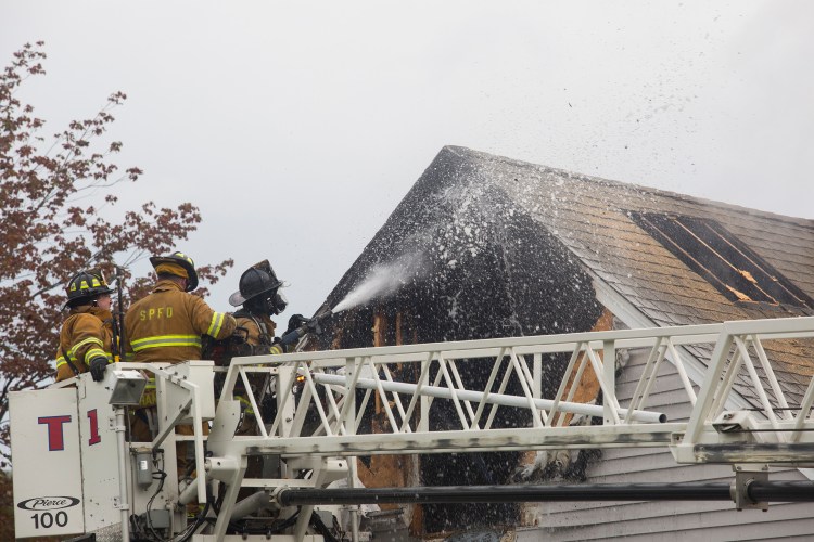Firefighters put out a fire in the second floor of a single family home at 12 Calais Street in South Portland on Tuesday morning. 