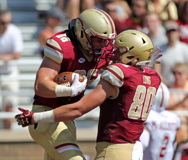 Boston College tight end Ray Marten (86) celebrates his TD with teammate Hunter Long (80) during the Eagles' 55-21 win over UMass on Saturday. 