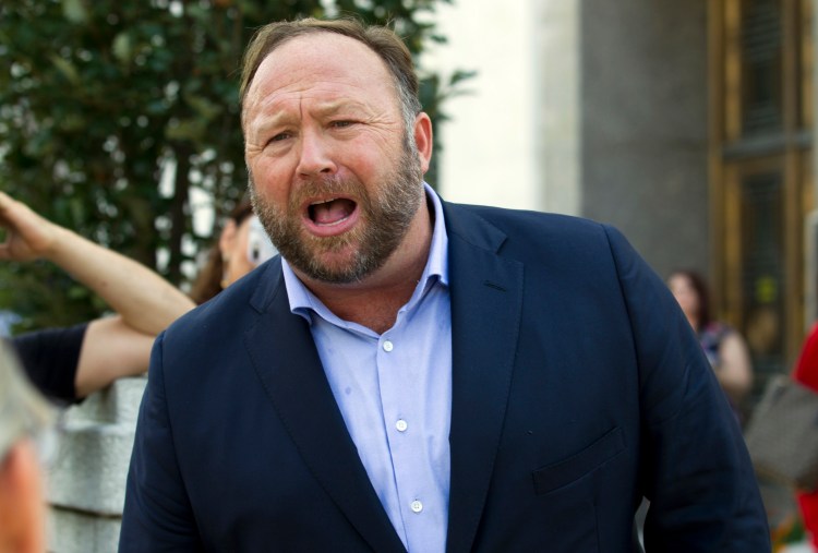Conspiracy theorist Alex Jones speaks outside of the Dirksen building of Capitol Hill after listening to Facebook COO Sheryl Sandberg and Twitter CEO Jack Dorsey testify before the Senate Intelligence Committee on Wednesday.