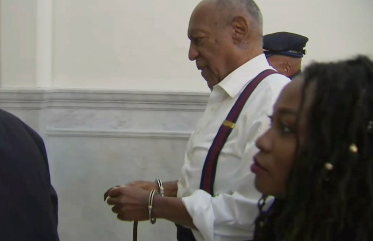 Bill Cosby leaves the courtroom after he was sentenced to serve three to 10 years in prison for felony sexual assault, on Tuesday in Norristown, Pa., in this image taken from video.