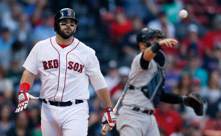 Boston Red Sox's Mitch Moreland walks back to the dugout after striking out in the ninth inning of a the Red Sox' 8-5 loss to the Yankees on Saturday in Boston. 