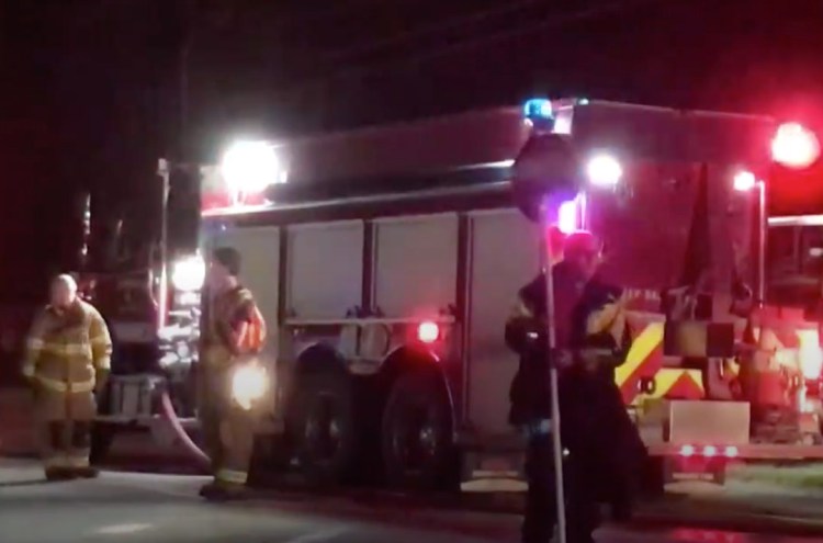 In this still image from News Center Maine video, firefighters work at the scene of Wednesday night's fire in Corinth.