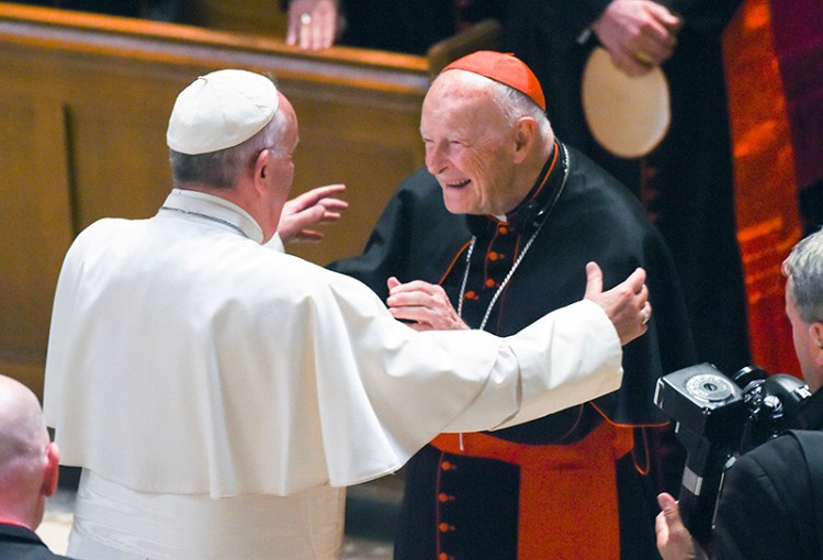 Pope Francis reaches out to hug Cardinal Archbishop emeritus Theodore McCarrick at the Cathedral of St. Matthew the Apostle in Washington. 