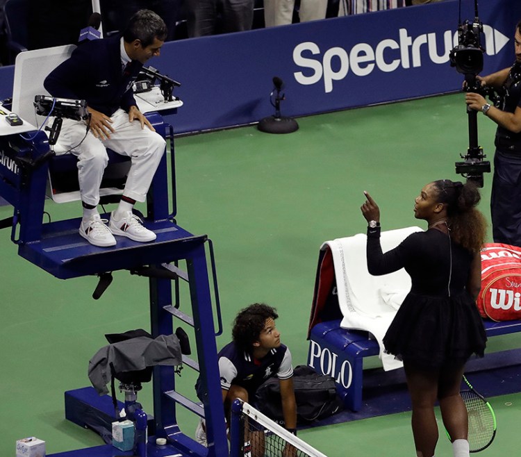 Serena Williams confronts with chair umpire Carlos Ramos at the end of the women's final of the U.S. Open tennis tournament on Saturday.