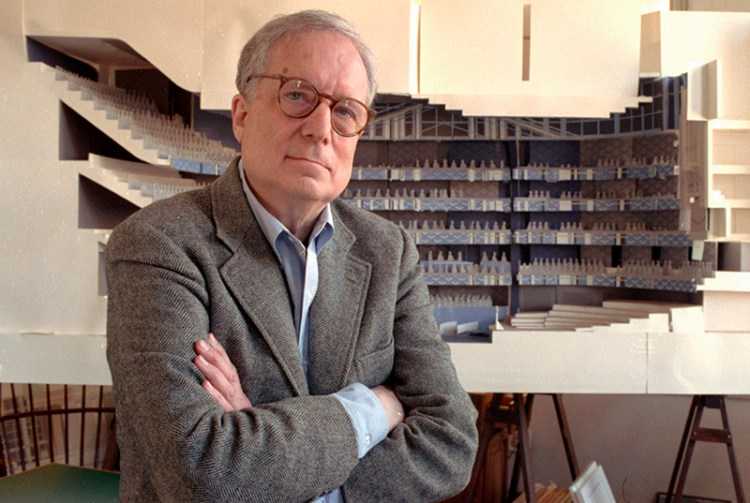Robert Venturi poses in his office in Philadelphia, with a model of a new hall for the Philadelphia Orchestra in background in 1991. 