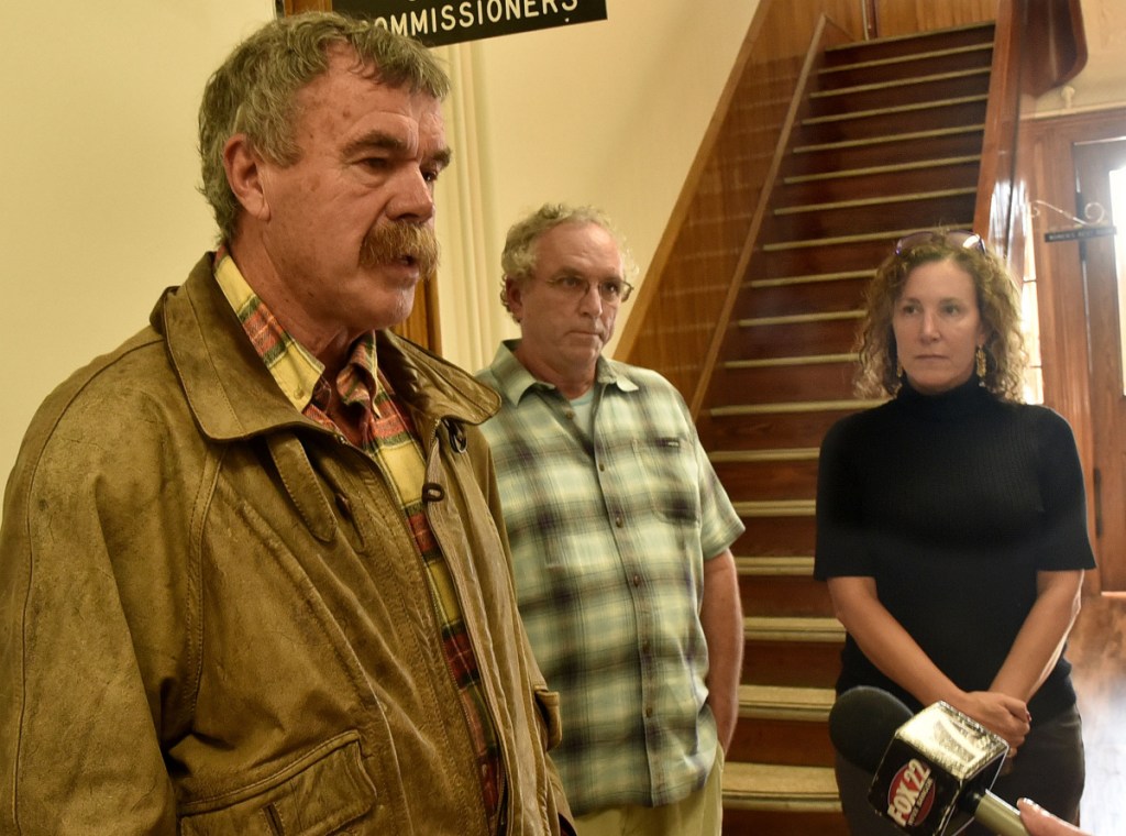 Pete Dostie, left, John Willard and Tania Merette all express opposition to the CMP New England Clean Energy Corridor project during a Somerset County commissioners meeting in Skowhegan on Wednesday.