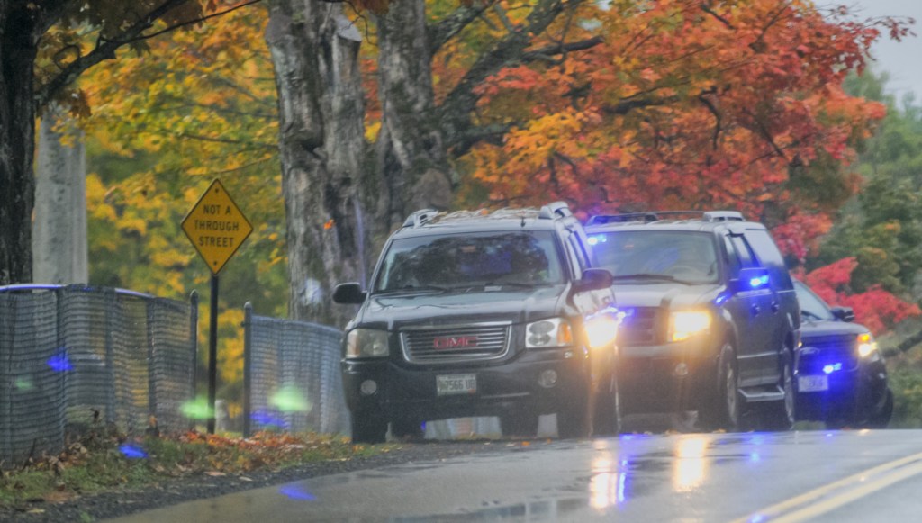 Augusta police leave the scene after making a vehicle stop Tuesday beside Coombs Mills Cemetery on Mount Vernon Road in Augusta. They stopped the vehicle in connection with an investigation into the robbery of a Subway on Bangor Street in Augusta.