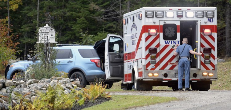 Maine State Police and Winthrop Ambulance attend to a stabbing victim Sunday at a residence on the Beaver Dam Road in Readfield.