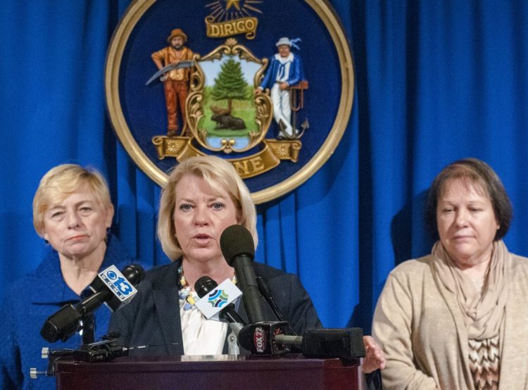 Deputy Attorney General Lisa Marchese, center, speaks during news conference Tuesday in the Hall of Flags at the Maine State House. Attorney General Janet Mills, left, and Barbara Theriault, mother of the late Amy Theriault, also spoke at the event.