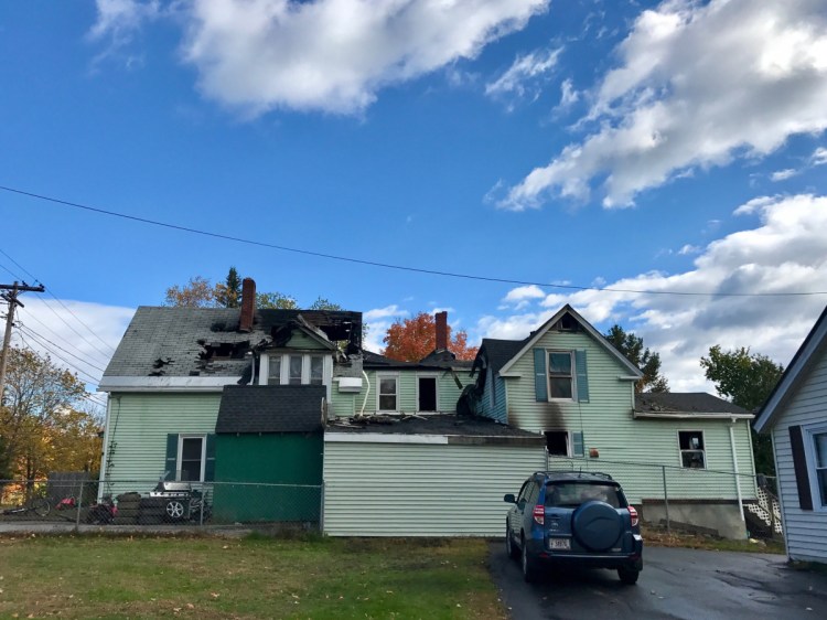 Damage can be seen on the side walls and roof of a duplex at 16 Winter St. in Fairfield that the Fairfield Fire Department said was destroyed early Saturday morning.
