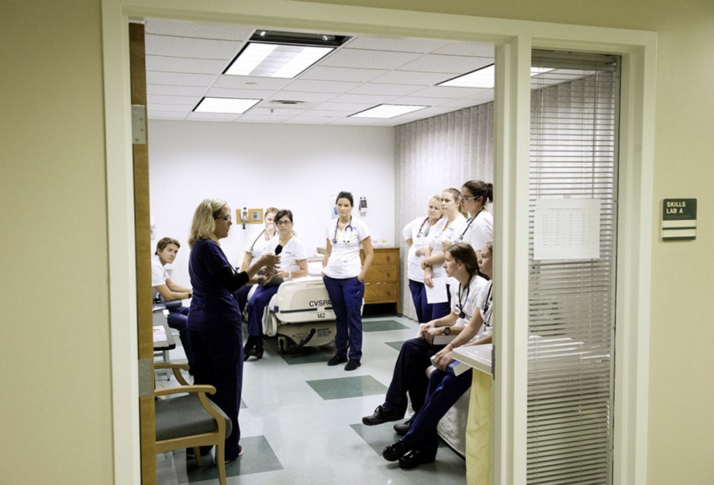 Registered Nurse Heidi Meek teaches how to make an initial visual evaluation of a patient to a freshman class of nursing students at the Maine College of Health Professions in Lewiston. 
