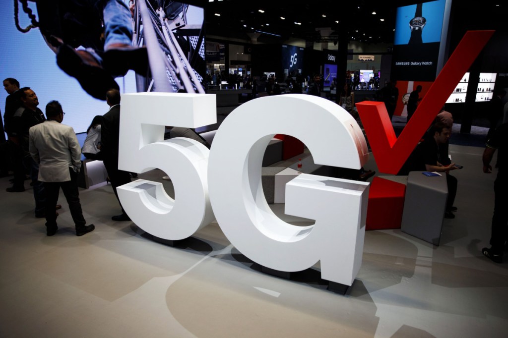 Verizon 5G wireless signage is displayed at the company's booth during the Mobile World Congress Americas in Los Angeles on Sept. 12. MUST CREDIT: Bloomberg photo by Patrick T. Fallon