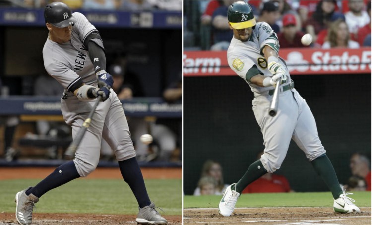Aaron Judge, left, was part of a Yankees lineup that set the major league record for homers in a season. The A's Khris Davis led the majors with 48 homers.