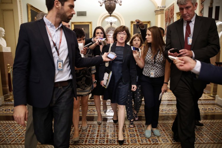 Reporters swarm Sen. Susan Collins last week on Capitol Hill. Political observers say Maine voters' level of engagement on President Trump’s latest Supreme Court nominee is unprecedented, and the focus on the up-or-down vote by Maine’s Republican senator has been intense.