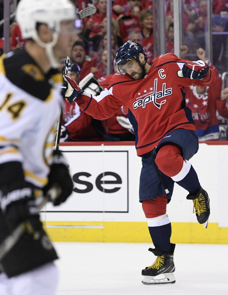 Capitals left wing Alex Ovechkin celebrates his second-period goal against the Boston Bruins on Wednesday night in the NHL season opener at Washington. The defending Stanley Cup champs scored just 24 seconds into the game to begin the rout.