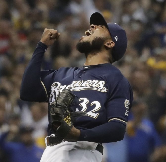 Milwaukee's Jeremy Jeffress reacts after getting Colorado Rockies' Ryan McMahon to ground out and end the Brewers' 4-0 win in Game 2 of the NLDS on Friday in Milwaukee.The Brewers took a 2-0 lead in the series.