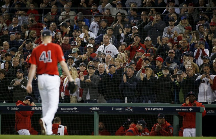 Fans cheers as Boston Red Sox starting pitcher Chris Sale leaves the baseball game against the New York Yankees during the sixth inning of Game 1 of an American League Division Series on Friday at Fenway Park. (AP Photo/Elise Amendola)