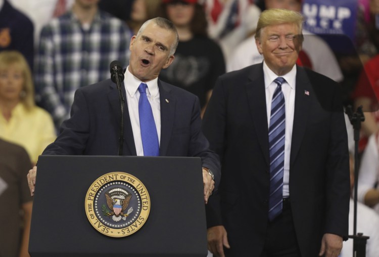 Republican Senate candidate Matt Rosendale and President Trump speak at a rally at the Rimrock Auto Arena in Billings, Mont., on Sept. 6. Rosendale faces Democratic Sen. Jon Tester in the midterm elections on Nov. 6. 