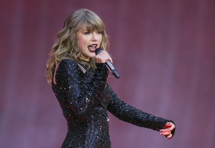 Singer Taylor Swift performs on stage in concert at Wembley Stadium in London. Swift posted on Instagram Sunday that she's voting for Tennessee's Democratic Senate candidate Phil Bredesen, breaking her long-standing refusal to discuss anything political.