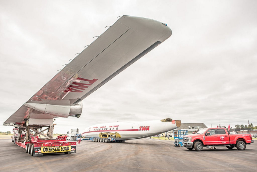 The wings, body and tail of the rare aircraft will travel as part of a six-truck, mile-long convoy to Queens to become part of the TWA hotel complex.