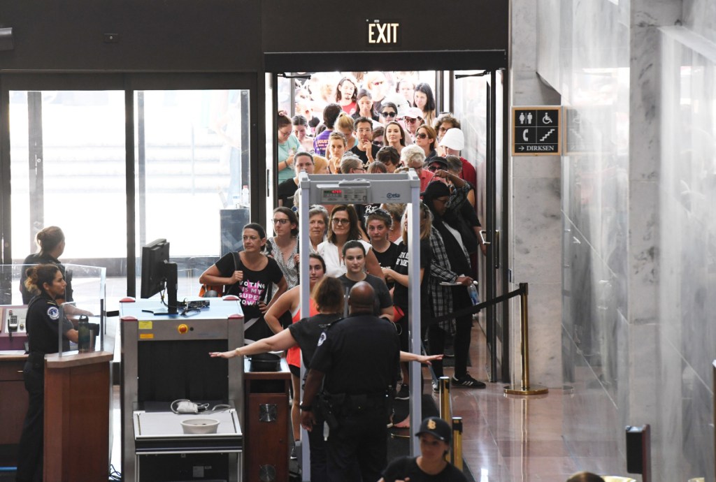 People go through security as they begin to gather at the Hart Senate Office Building in Washington, D.C., during a Thursday rally against Brett Kavanaugh.