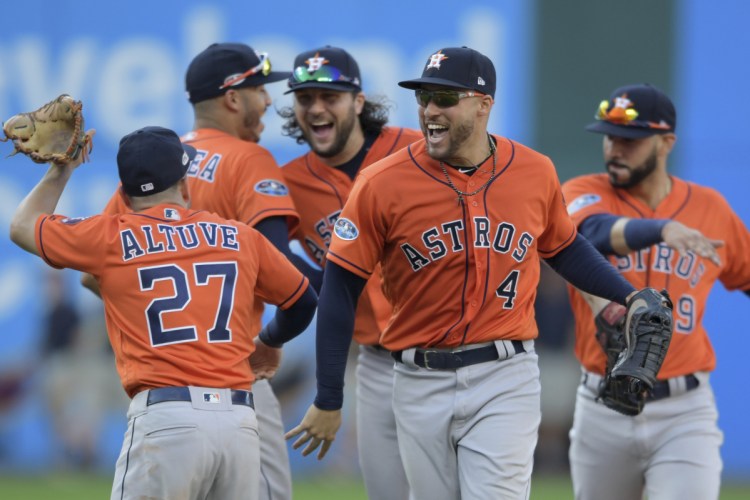 The Astros celebrate after sweeping the Indians in the ALDS on Monday. In the three wins, Houston outscored Cleveland 21-6 and outhit them, .327 to .144 with eight home runs.