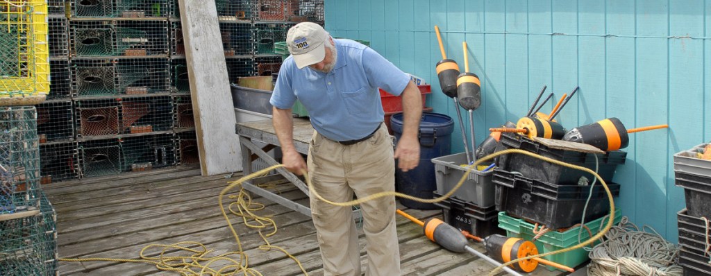 Don Jackson of Scarborough organizes some floating lines found on a trip to use them for other purposes like tie-ups and line extensions on Union and Widgery wharves in 2008.
