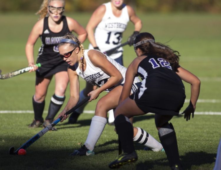 WESTBROOK, ME - OCTOBER 16: Westbrook senior Alexis Witham (12) tries to get the ball past Marshwood sophomore Isabella Schultze (12) during their playoff game at Westbrook High School on Tuesday, October 16, 2018. (Staff photo by Brianna Soukup/Staff Photographer)