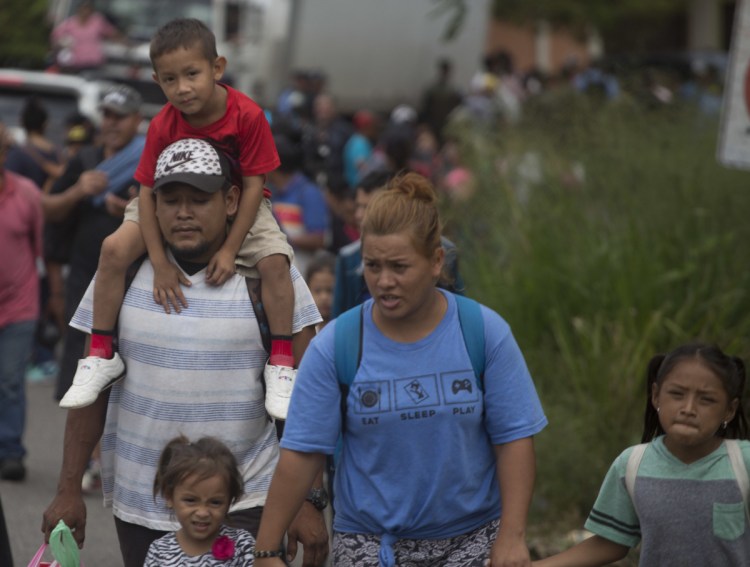 Some 2,000 Hondurans move toward the border with Guatemala to flee poverty and violence and seek new lives in the United States, in Ocotepeque, Honduras, on Monday.