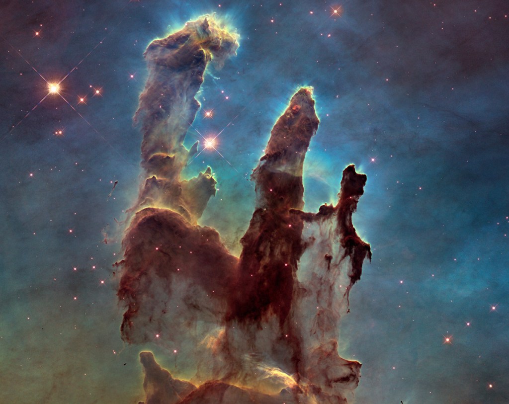 The famous Pillars of Creation, at the heart of the Eagle Nebula, is just one of many striking images taken by the Hubble Space Telescope. At left, the telescope is deployed in 1990.