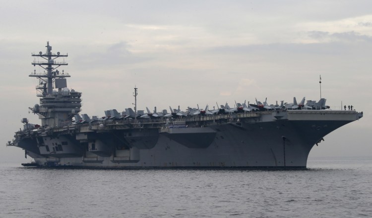The U.S. aircraft carrier USS Ronald Reagan anchors off Manila Bay, Philippines in June.