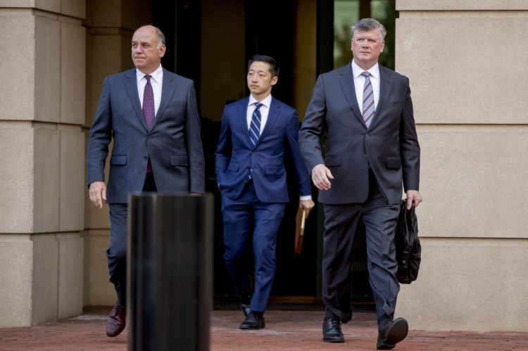 Members of the defense team for Paul Manafort, from left, Kevin Downing, Tim Wang and Thomas Zehnle, depart the federal court following a hearing in the criminal case against former Trump campaign chairman Paul Manafort in Alexandria, Virginia, on Friday.