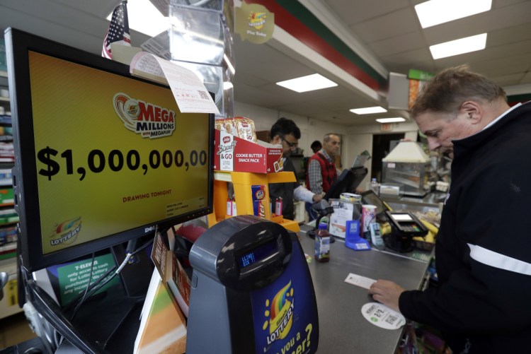 A sign displays the estimated Mega Millions jackpot at a convenience store in Chicago on Friday. No one won Friday's jackpot of $1 billion, the second-largest prize in U. S. lottery history.