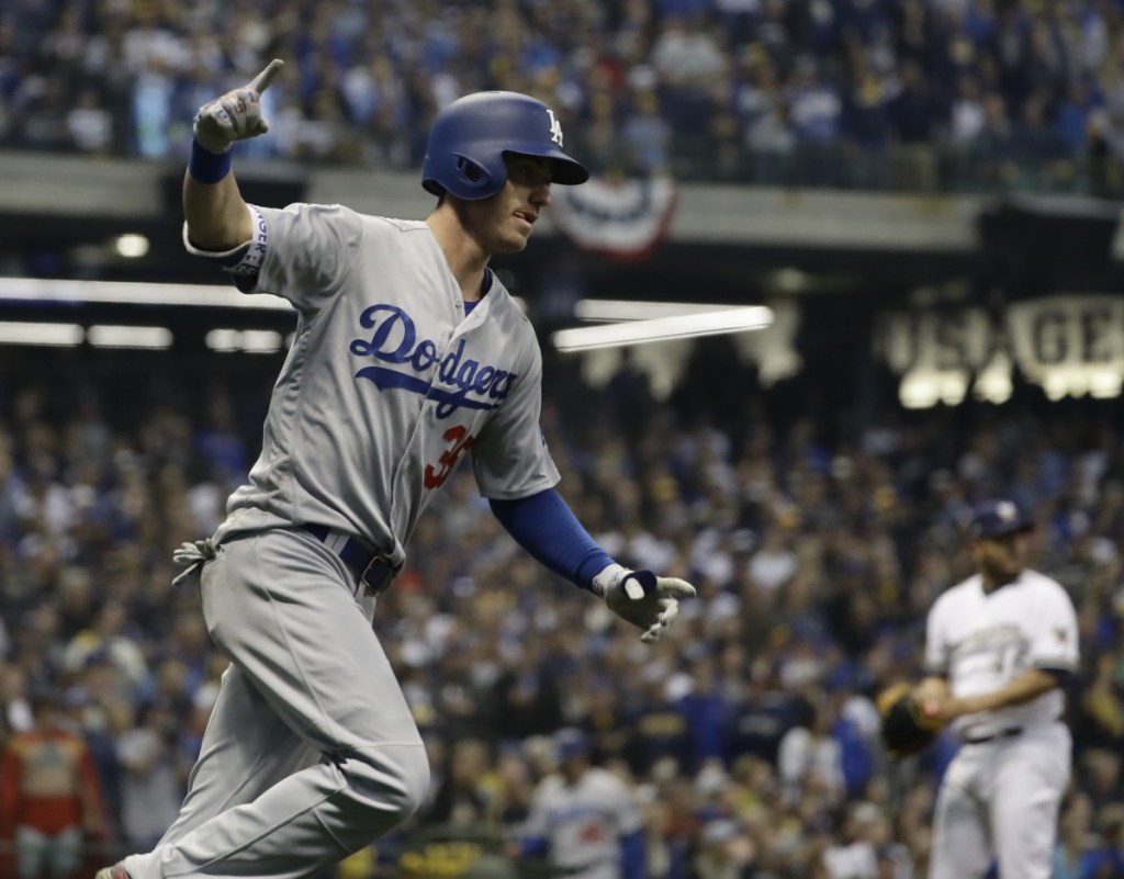 Cody Bellinger celebrates after hitting a two-run home run during the second inning of Game 7 against the Milwaukee.