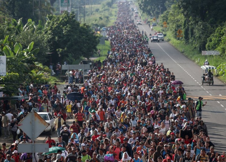 Thousands of migrants from Central America walk toward Tapachula from Ciudad Hidalgo, Mexico, en route to the U.S. on Sunday. One of the caravan's organizers estimated the group had swelled to more than 5,000.