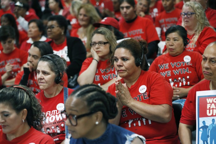 Members of the Culinary Union listen to Democratic candidates during an Oct. 17 event at the union hall in Las Vegas. Latinos have a spotty track record in midterm elections. The Democrats need heavy Latino support to win several Senate races and take back control of the House. (Associated Press/John Locher)