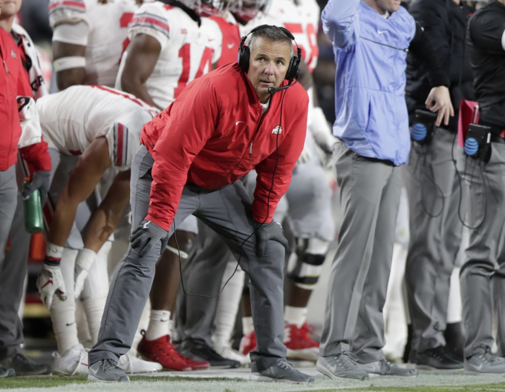 Ohio State Coach Urban Meyer could do little but watch Saturday night as the Buckeyes lost 49-20 at Purdue. The setback dropped Ohio State to No. 11 in The Associated Press poll.