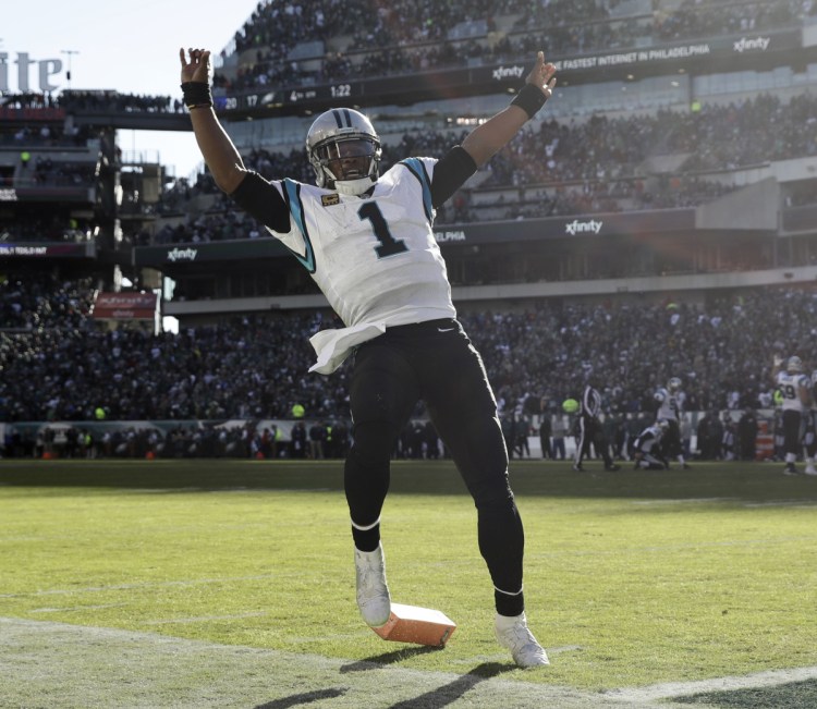 Cam Newton celebrates after his touchdown pass to Greg Olsen capped Carolina's fourth-quarter rally for a 21-17 win over the Eagles.