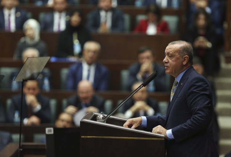 Turkey's President Recep Tayyip Erdogan addresses members of his ruling Justice and Development Party, in Ankara, Turkey on Tuesday. Turkey's president says Saudi officials started planning to murder Saudi writer Jamal Khashoggi days before his death in Saudi Arabia's Istanbul consulate.