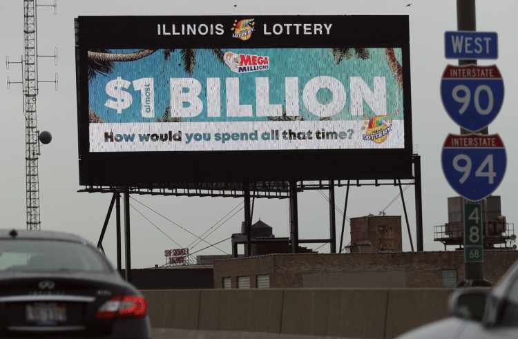 A digital billboard along Interstate 90/94 highway in Chicago displays the estimated Mega Millions jackpot on Friday. It has continued to grow and the next drawing is Tuesday.