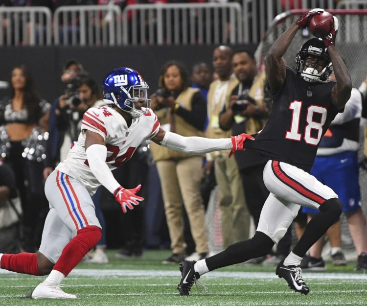 Falcons wide receiver Calvin Ridley hauls in a catch against Giants cornerback Eli Apple during Monday night's game in Atlanta. The Falcons won 23-20.