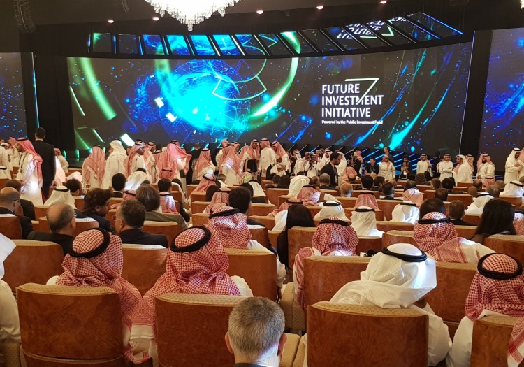 Participants take their seats Tuesday during the opening day of the Future Investment Initiative conference, also known as "Davos in the Desert," at the Ritz Carlton Hotel in Riyadh, Saudi Arabia.